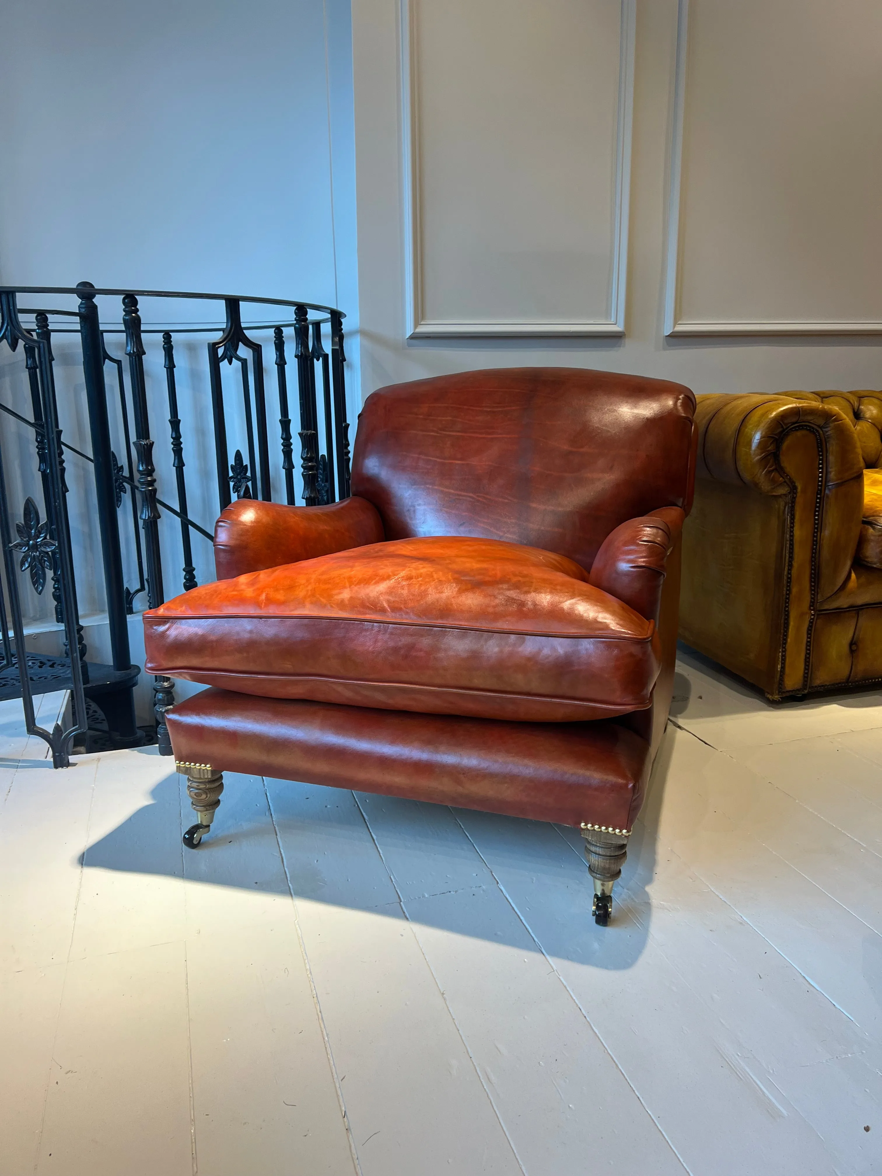 Our Matthew Armchair finished in Hand Dyed Terracotta Leather