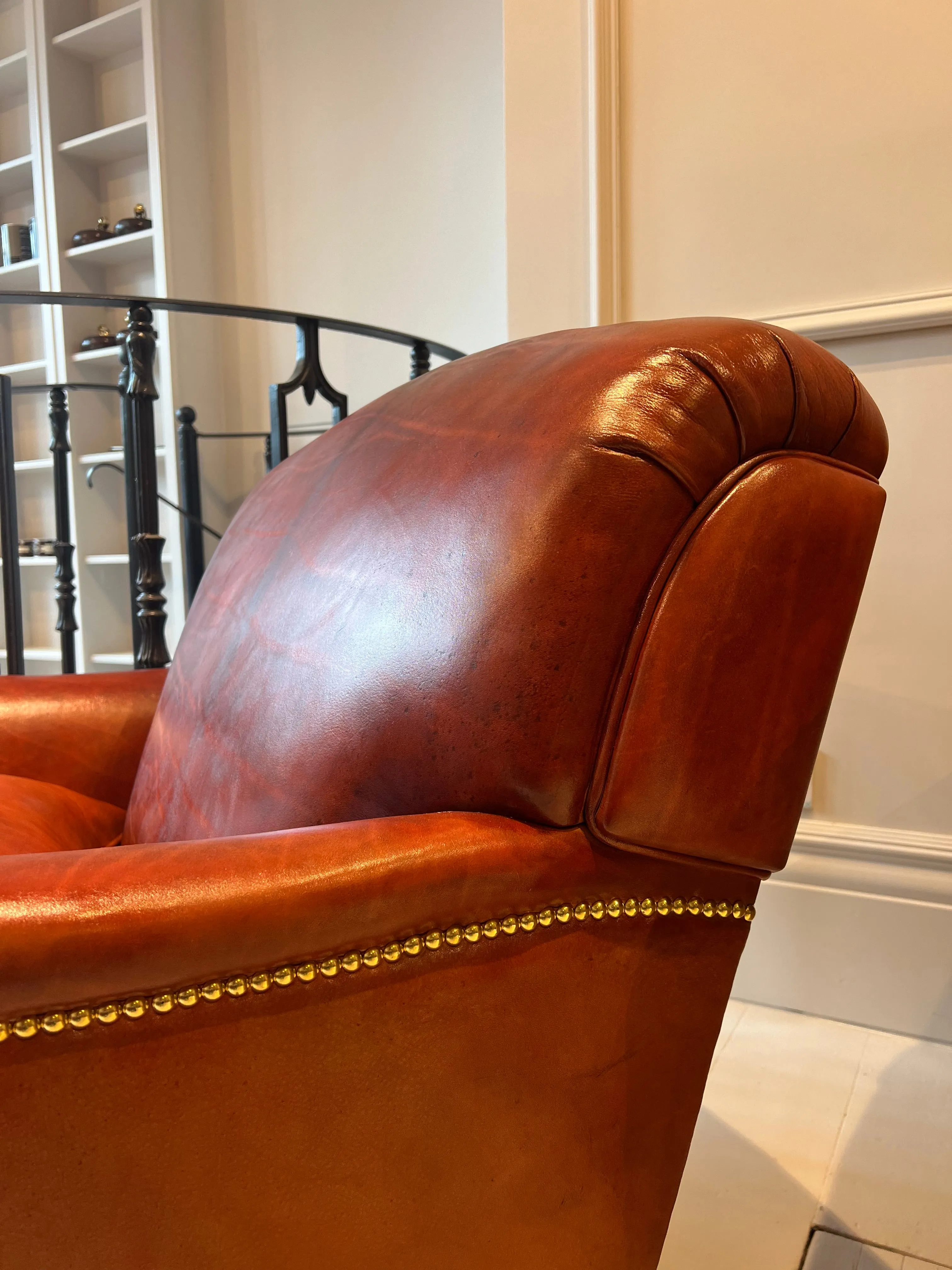 Our Matthew Armchair finished in Hand Dyed Terracotta Leather